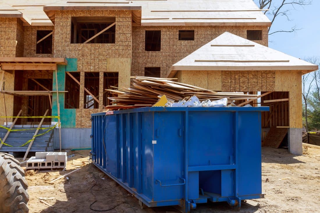 30-yard open-top container at a commercial warehouse loading dock