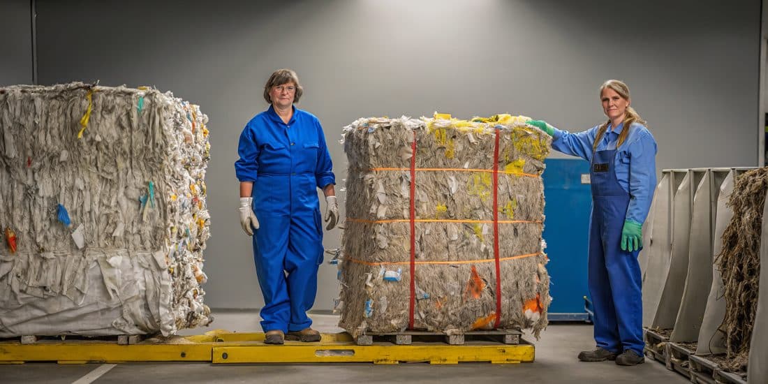 Compressed bales of sorted textiles at a recycling facility